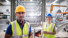 Man and Woman in hard hats