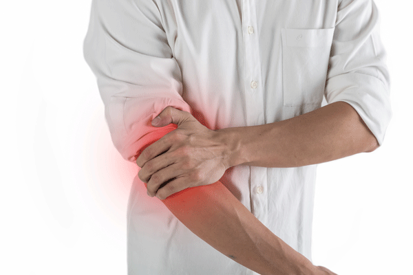 worker holding elbow suffering from lateral epicondylitis